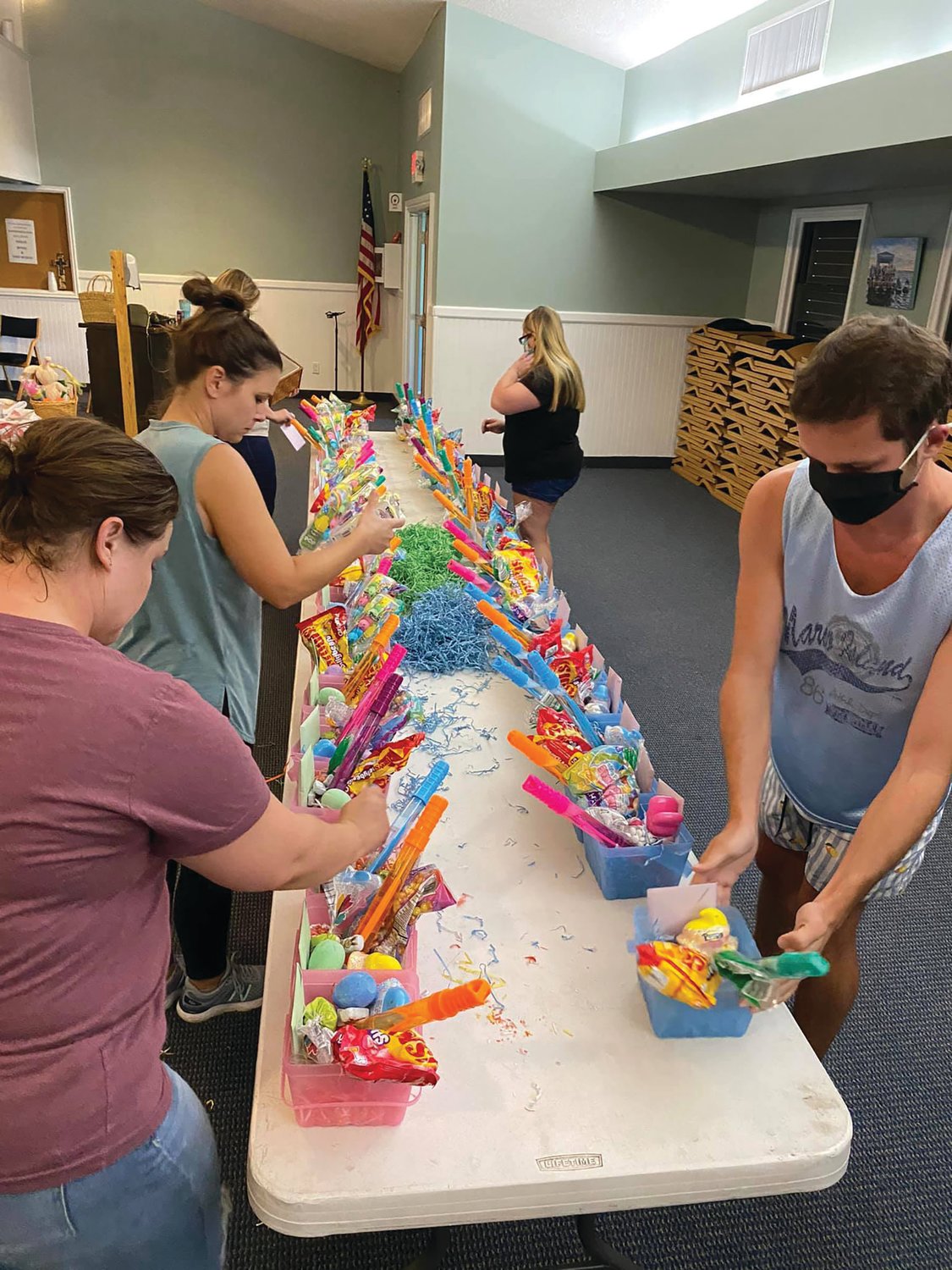 Volunteers with the Treasure Coast Foster Closet assemble baskets for local foster families.